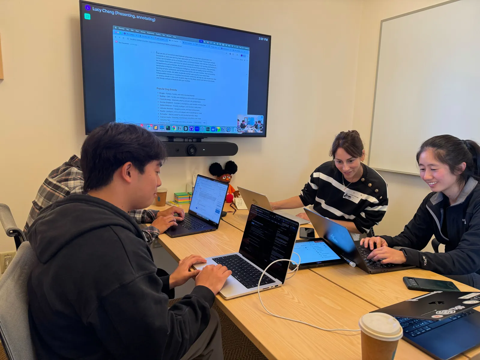 Image may contain Computer Electronics Laptop Pc Adult Person Cup Teen Computer Hardware Hardware and Monitor